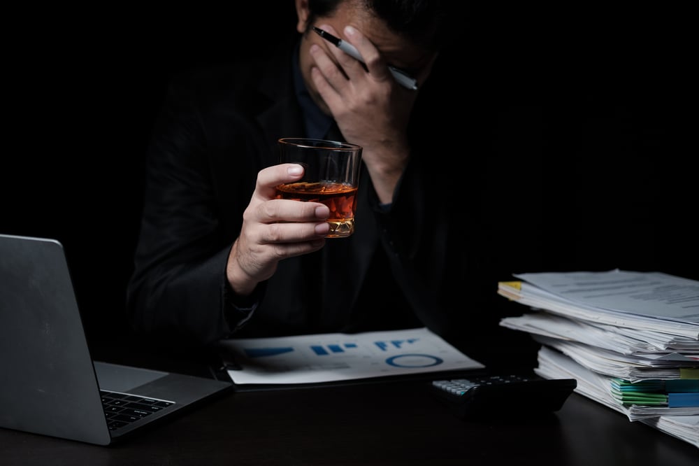 frustrated-business-man-with-drink-in-dark-room-2026-09-23-06-32-33-utc frustrated-business-man-with-drink-in-dark-room-2026-09-23-06-32-33-utc